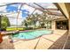 Screened pool and spa with a lake view at 4848 Island Shores Ln, Lakeland, FL 33809