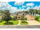 Beautiful lakefront home with manicured landscaping at 4848 Island Shores Ln, Lakeland, FL 33809