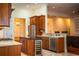 Kitchen with wood cabinets, granite countertops and stainless steel appliances at 4848 Island Shores Ln, Lakeland, FL 33809