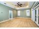 Bright bedroom featuring neutral walls, carpeting, and access to bathroom at 4848 Island Shores Ln, Lakeland, FL 33809