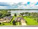 Lakefront property with a house and lush landscaping at 4848 Island Shores Ln, Lakeland, FL 33809