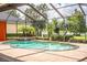 Relaxing kidney-shaped pool with a waterfall feature at 4848 Island Shores Ln, Lakeland, FL 33809