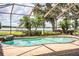 Large, kidney-shaped pool with a lake view at 4848 Island Shores Ln, Lakeland, FL 33809