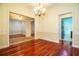 Bright dining room with hardwood floors and access to kitchen at 4848 Island Shores Ln, Lakeland, FL 33809