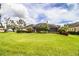 Large backyard with lush grass and home at 4848 Island Shores Ln, Lakeland, FL 33809