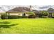 Spacious backyard with a screened patio and lush landscaping at 4848 Island Shores Ln, Lakeland, FL 33809