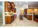 Kitchen with wood cabinets, granite countertops and stainless steel appliances at 4848 Island Shores Ln, Lakeland, FL 33809
