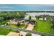 Luxury waterfront home with expansive lake views and lush landscaping at 4848 Island Shores Ln, Lakeland, FL 33809