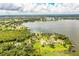 Lakefront home with private dock and lush landscaping at 4848 Island Shores Ln, Lakeland, FL 33809
