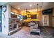 Outdoor kitchen with stone finishes, built-in appliances, and a ceiling fan at 4848 Island Shores Ln, Lakeland, FL 33809