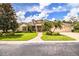 Two-story house with a three-car garage and a nicely landscaped yard at 4848 Island Shores Ln, Lakeland, FL 33809