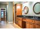 Double vanity bathroom with granite countertop and wood cabinets at 4848 Island Shores Ln, Lakeland, FL 33809