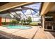 Enjoy lake views from this screened pool and spa area at 4848 Island Shores Ln, Lakeland, FL 33809