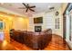 Living room with hardwood floors, built-in shelving, and a fireplace at 4848 Island Shores Ln, Lakeland, FL 33809