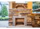 Rustic stone fireplace with arched top, perfect for outdoor entertaining at 4848 Island Shores Ln, Lakeland, FL 33809