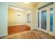 Bright entryway with hardwood floors, a chandelier, and French doors at 4848 Island Shores Ln, Lakeland, FL 33809