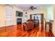 Living room with hardwood floors, built-in shelving, and a fireplace at 4848 Island Shores Ln, Lakeland, FL 33809