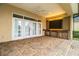 Outdoor kitchen with brickwork, stainless steel appliances, and a ceiling fan at 4848 Island Shores Ln, Lakeland, FL 33809