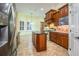 Kitchen boasts a large island, stainless steel appliances, and tile flooring at 4848 Island Shores Ln, Lakeland, FL 33809