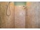 Large walk-in shower with beige tile and double shower heads at 4848 Island Shores Ln, Lakeland, FL 33809