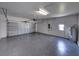 Spacious garage with epoxy floor, overhead storage, and automatic door opener at 5217 Snowy Heron Dr, Lakeland, FL 33812