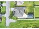 House with a large backyard and a detached garage at 4756 Acorn Dr, Mulberry, FL 33860