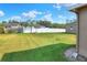 Large grassy backyard with privacy fence at 4756 Acorn Dr, Mulberry, FL 33860