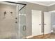 Large walk-in shower with dual shower heads and frameless glass enclosure at 4756 Acorn Dr, Mulberry, FL 33860