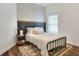 Cozy bedroom with metal bed frame and unique wall decor at 4756 Acorn Dr, Mulberry, FL 33860
