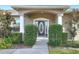 House with a covered front porch and a decorative front door at 4756 Acorn Dr, Mulberry, FL 33860