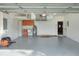 Spacious garage with built-in cabinets, sink, and overhead storage at 4756 Acorn Dr, Mulberry, FL 33860