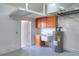Garage with workshop, sink, and hot water heater at 4756 Acorn Dr, Mulberry, FL 33860