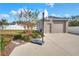 Detached garage with basketball court and landscaping at 4756 Acorn Dr, Mulberry, FL 33860