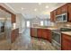 Spacious kitchen with stainless steel appliances and wood cabinets at 4756 Acorn Dr, Mulberry, FL 33860