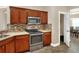 Kitchen with stainless steel appliances and wood cabinets at 4756 Acorn Dr, Mulberry, FL 33860