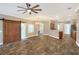 Open living room with sliding barn door and fireplace at 4756 Acorn Dr, Mulberry, FL 33860