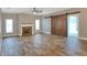 Spacious living room with fireplace and wood floors at 4756 Acorn Dr, Mulberry, FL 33860