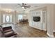 Living room with built-in entertainment center and tiled floors at 4756 Acorn Dr, Mulberry, FL 33860