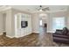 Living area with a view into the dining area and fireplace at 4756 Acorn Dr, Mulberry, FL 33860
