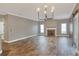 Bright living room with a fireplace and chandelier at 4756 Acorn Dr, Mulberry, FL 33860