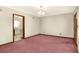 Spacious dining room with pink carpet and a chandelier at 537 S Clayton Ave, Lakeland, FL 33801