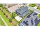Aerial view of house and backyard with solar panels and pool at 6857 Eagle Ridge Loop, Lakeland, FL 33813