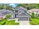 Two-story house with gray exterior and a two-car garage at 6857 Eagle Ridge Loop, Lakeland, FL 33813