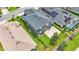 Aerial view showing home's backyard, patio, pool, and surrounding neighborhood at 6857 Eagle Ridge Loop, Lakeland, FL 33813