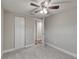 Cozy bedroom with ceiling fan and access to hallway at 2907 Ellis Ave, Lakeland, FL 33803