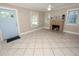 Living room with tile floors, fireplace, and ceiling fan at 714 Winfree Ave, Lakeland, FL 33801