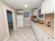 Updated kitchen with white cabinets and modern appliances at 714 Winfree Ave, Lakeland, FL 33801