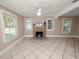 Spacious living room with tile floors, fireplace and lots of natural light at 714 Winfree Ave, Lakeland, FL 33801