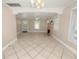 Spacious living room featuring tile floors, fireplace, and large windows at 714 Winfree Ave, Lakeland, FL 33801