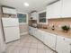 Updated kitchen featuring white cabinets and modern appliances at 714 Winfree Ave, Lakeland, FL 33801